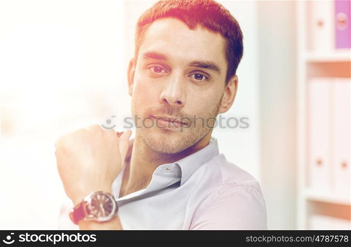 business, people and work concept - portrait of businessman in office