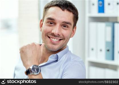 business, people and work concept - portrait of smiling businessman face in office