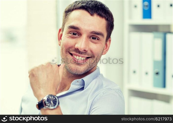 business, people and work concept - portrait of smiling businessman face in office