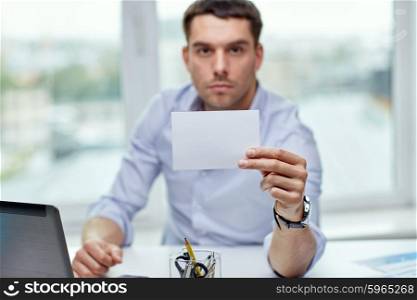 business, people, announcement and advertisement concept - businessman showing blank paper card at office