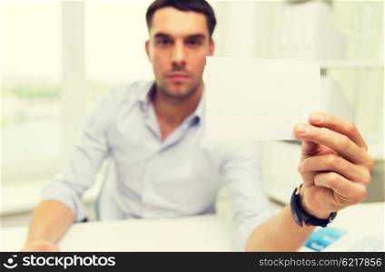 business, people, announcement and advertisement concept - close up of businessman showing blank paper card at office