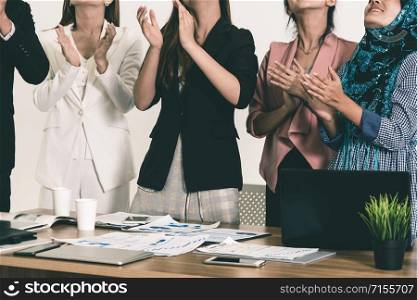 Business people applauding in a business meeting. Conference and presentation award concept.