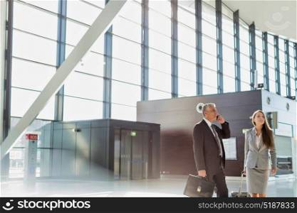 Business people arriving in airport