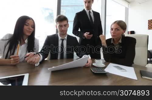 Business people asking your opinion about documents