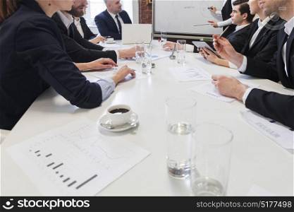 Business people at meeting table. Business people at meeting table work with documents and financial data together