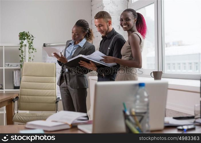 Business people at office talking and working together. Office life concept.