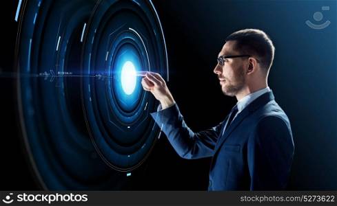 business, people, augmented reality and future technology concept - businessman in glasses with virtual projection over black background. businessman in glasses with virtual projection