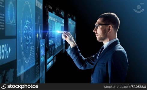 business, people, augmented reality and future technology concept - businessman in glasses with virtual screens projection over black background. businessman in glasses with virtual projection