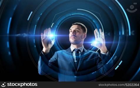 business, people, augmented reality and future technology concept - businessman in suit with virtual projection over black background. businessman with virtual projection over black