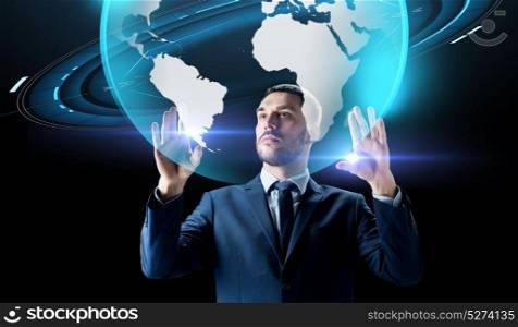 business, people, augmented reality and future technology concept - businessman with virtual earth hologram over black background. businessman with earth hologram over black