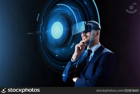 business, people, augmented reality and modern technology concept - businessman in virtual headset looking at projection over black background. businessman in virtual reality headset