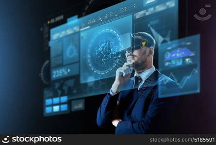 business, people, augmented reality and modern technology concept - businessman in virtual headset looking at screens projection over black background. businessman in virtual reality headset and screens