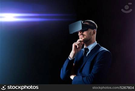 business, people, augmented reality and modern technology concept - businessman in virtual headset over black background and laser light. businessman in virtual reality headset over black