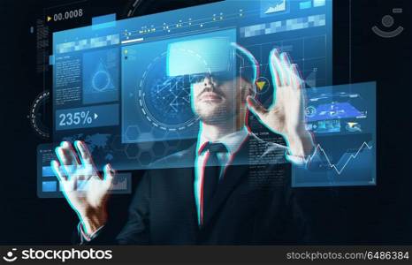 business, people, augmented reality and modern technology concept - businessman in virtual headset touching screen projection over black background. businessman in virtual reality headset with screen. businessman in virtual reality headset with screen