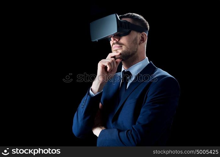 business, people, augmented reality and modern technology concept - businessman in virtual headset over black background. businessman in virtual reality headset over black