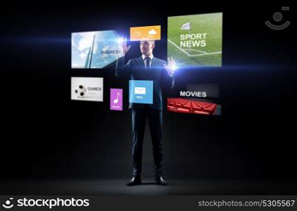 business, people, augmented reality and multimedia concept - businessman with applications on virtual screen over black background. businessman with applications on virtual screen
