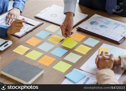 Business People brainstorming Meeting Design Ideas use post it notes to share idea professional investor start up project business brainstorming planning in office.