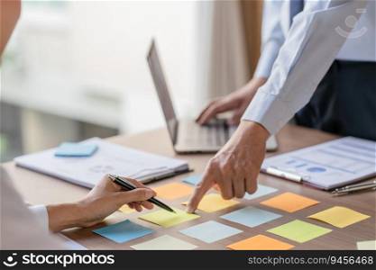 Business People brainstorming Meeting Design Ideas use post it notes to share idea professional investor start up project business brainstorming planning in office.