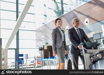 Business people checking their bags in airport