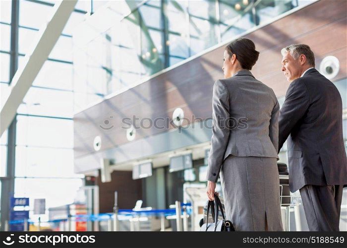 Business people checking their bags in airport