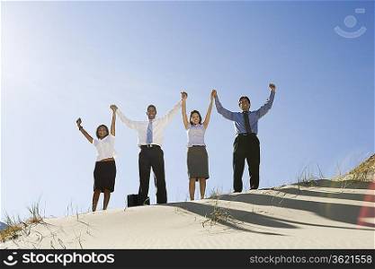 Business People Cheering in the Desert
