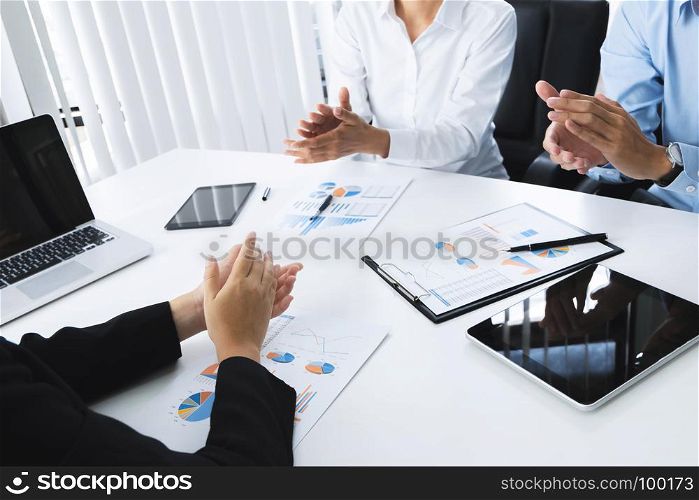 business people clap hands agreement success deal with partnership at a meeting