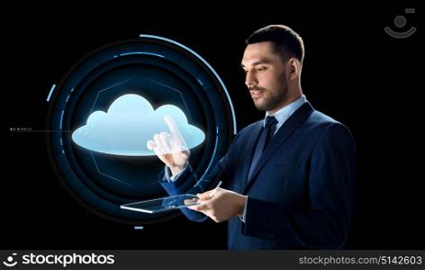 business, people, cloud computing and modern technology concept - businessman in suit working with transparent tablet pc computer and virtual projection over black background. businessman with tablet pc and cloud projection