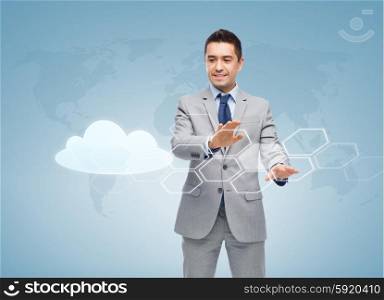 business, people, cloud computing and technology concept - happy smiling businessman in suit working with virtual screens over blue background