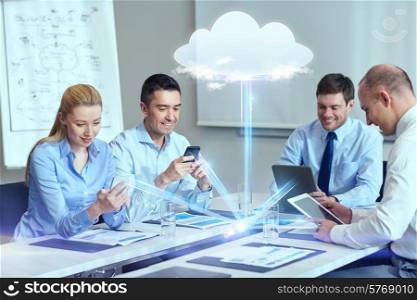 business, people, cloud computing and technology concept - smiling business team with smartphones, tablet pc computers working in office