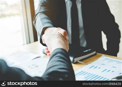 Business people colleagues shaking hands meeting Planning Strategy Analysis Concept