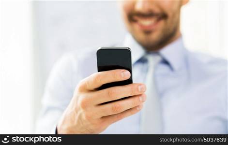 business, people, communication and technology concept - close up of businessman with smartphone. close up of businessman with smartphone