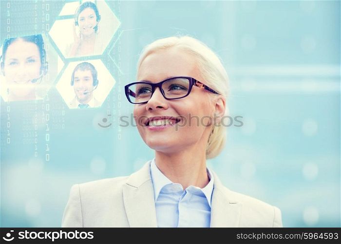 business, people, communication and technology concept - young smiling businesswoman and virtual screens with video chat outdoors