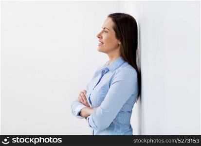 business people concept - happy smiling middle aged woman at office. happy smiling middle aged woman at office