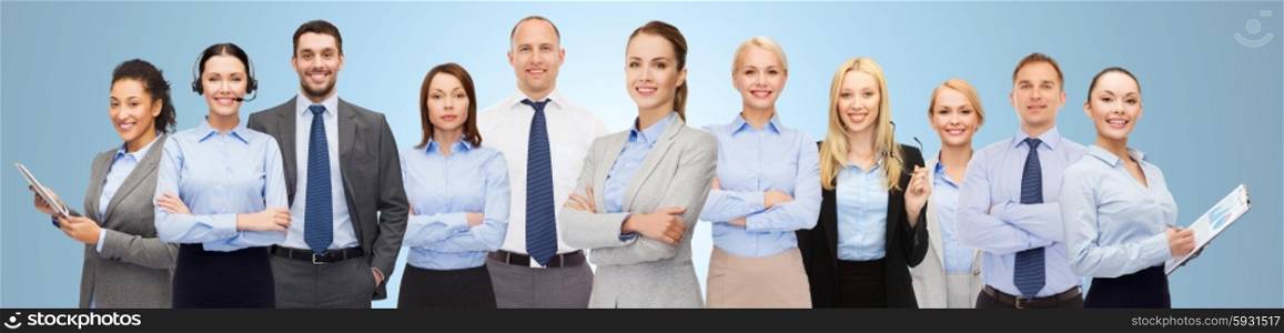 business, people, corporate, teamwork and office concept - group of happy businesspeople over blue background