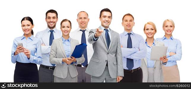 business, people, corporate, teamwork and office concept - group of happy businesspeople pointing at you