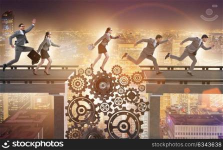 Business people crossing the bridge with cogwheels