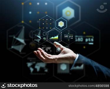 business, people, cyberspace and future technology concept - businessman hand with virtual hologram of charts and projections over dark background