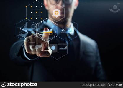 business, people, cyberspace and future technology concept - close up of businessman in suit working with virtual charts over dark background