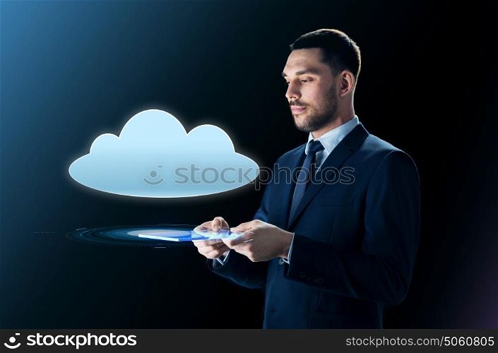 business, people, cyberspace, computing and modern technology concept - businessman in suit with transparent tablet pc computer and cloud projection over black background. businessman with tablet pc and cloud projection