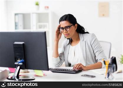 business, people, deadline and technology concept - stressed businesswoman with computer at office. stressed businesswoman with computer at office