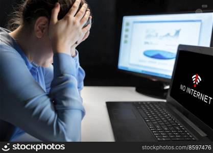 business, people, deadline, stress and technology concept - businesswoman with laptop having no internet signal at office at night. sad woman having no internet on laptop at office