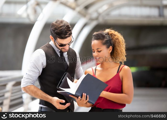 Business People Discussing While Standing On Footbridge