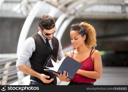 Business People Discussing While Standing On Footbridge