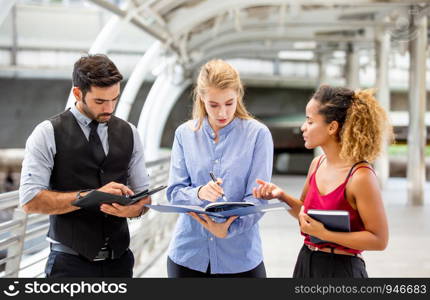 Business People Discussing While Standing On Footbridge