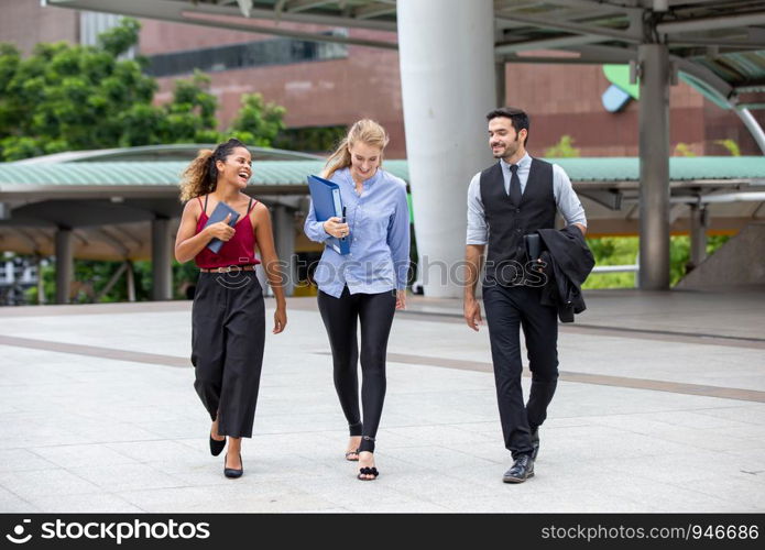 Business People Discussing While walking On Footbridge