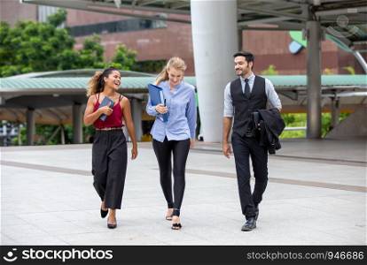 Business People Discussing While walking On Footbridge