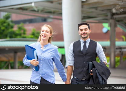 Business People Discussing While walking On Footbridge