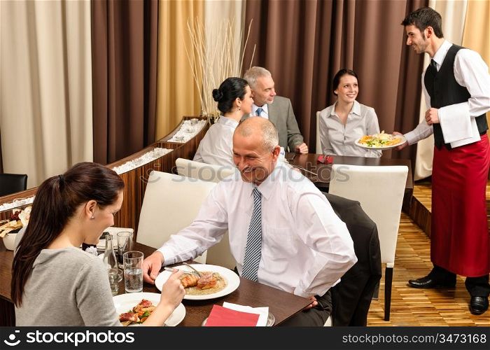 Business people enjoy lunch meal at restaurant management discussion