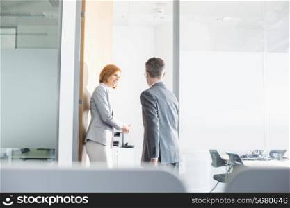 Business people entering into conference room