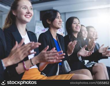 Business people executives applauding in business meeting